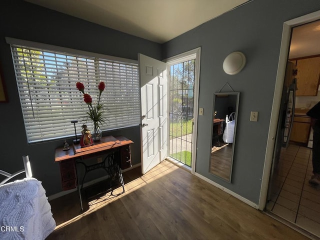 entryway with hardwood / wood-style flooring