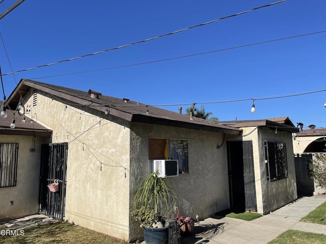 view of property exterior with cooling unit