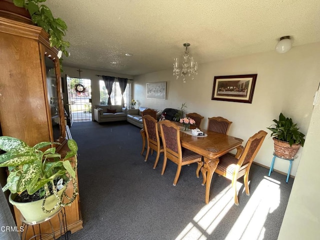 carpeted dining room featuring a textured ceiling and a notable chandelier