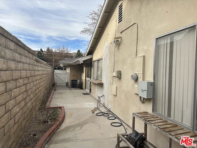 view of side of home featuring a patio