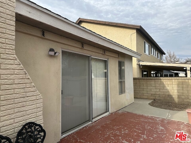 view of property exterior featuring a patio