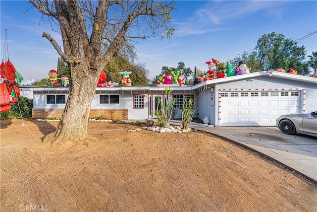 single story home featuring a garage