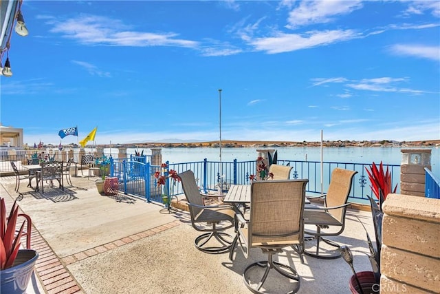 view of patio with a water view