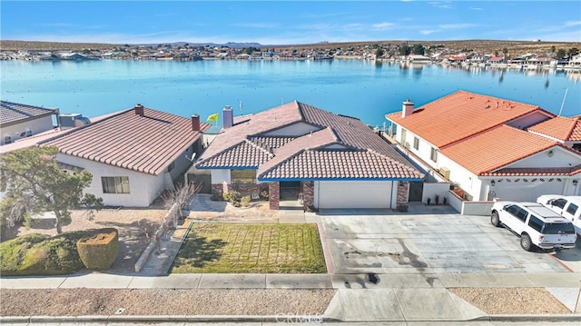 drone / aerial view with a water view