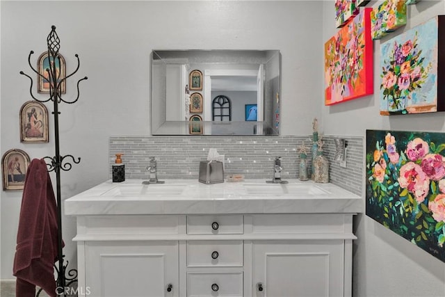 bathroom featuring vanity and backsplash