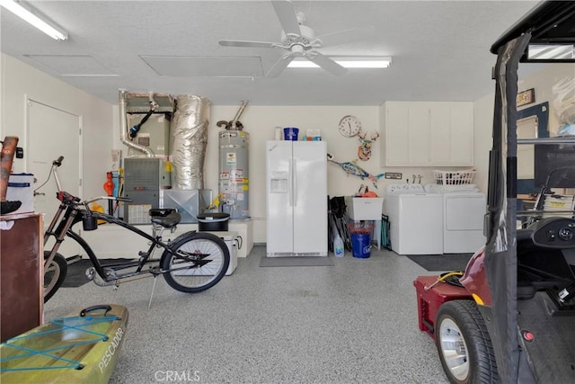 garage featuring ceiling fan, white refrigerator with ice dispenser, gas water heater, and independent washer and dryer