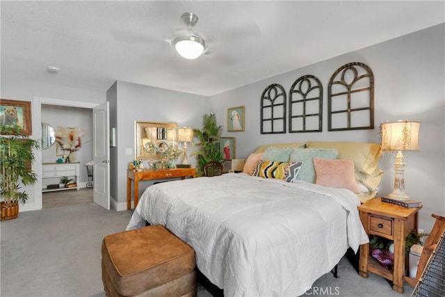 bedroom with ceiling fan and light carpet