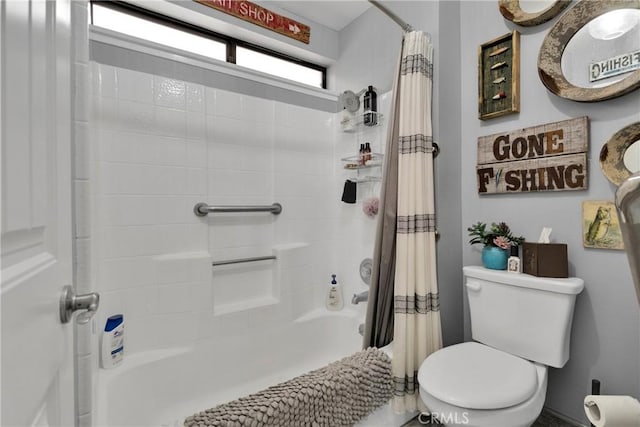 bathroom featuring toilet and shower / tub combo with curtain