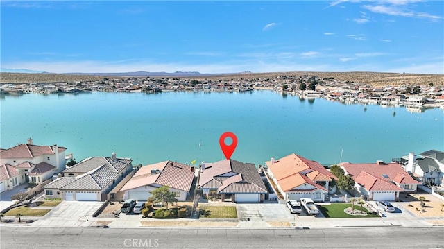 birds eye view of property featuring a water view