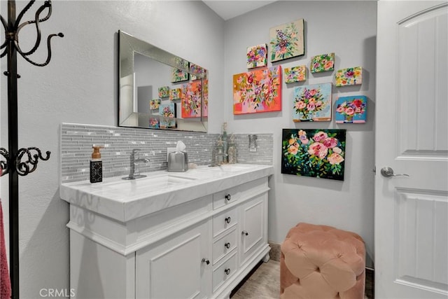 bathroom with vanity and decorative backsplash