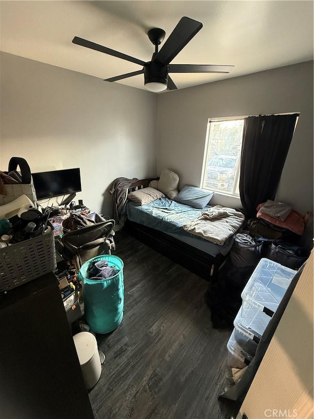 bedroom featuring ceiling fan and wood-type flooring