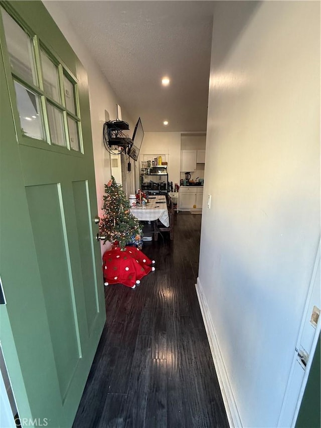 hallway featuring dark wood-type flooring