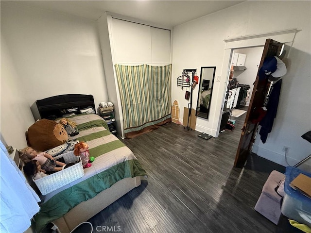 bedroom featuring dark wood-type flooring