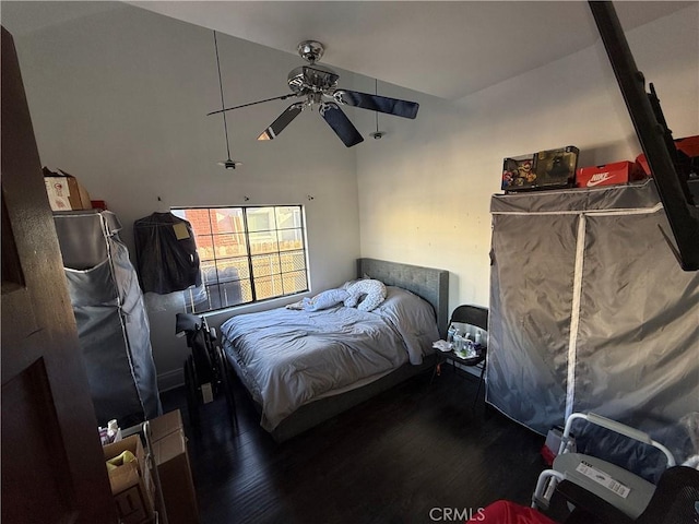 bedroom with ceiling fan and hardwood / wood-style floors