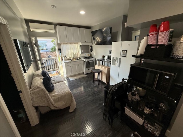 living room with dark wood-type flooring and a wall unit AC