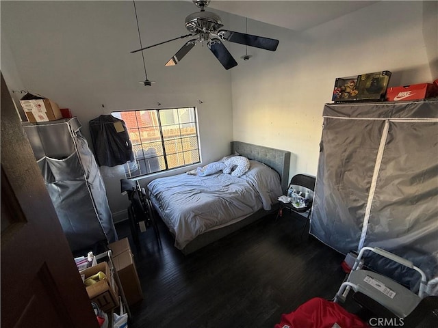 bedroom with ceiling fan and dark hardwood / wood-style flooring