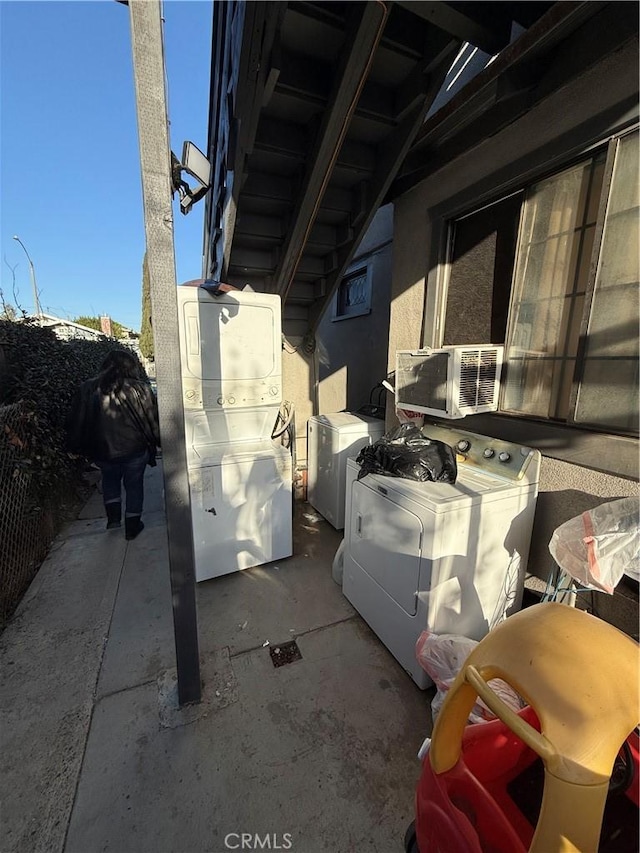 view of patio featuring separate washer and dryer and cooling unit