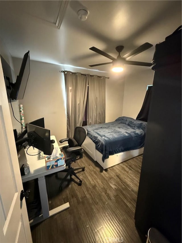 bedroom with ceiling fan and wood-type flooring