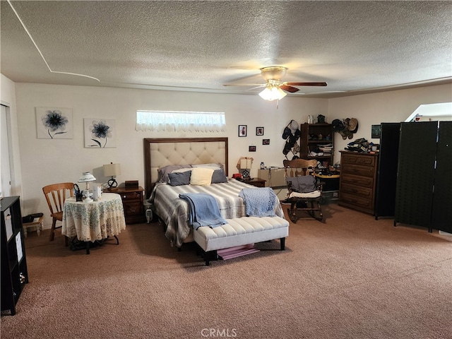 carpeted bedroom featuring ceiling fan and a textured ceiling