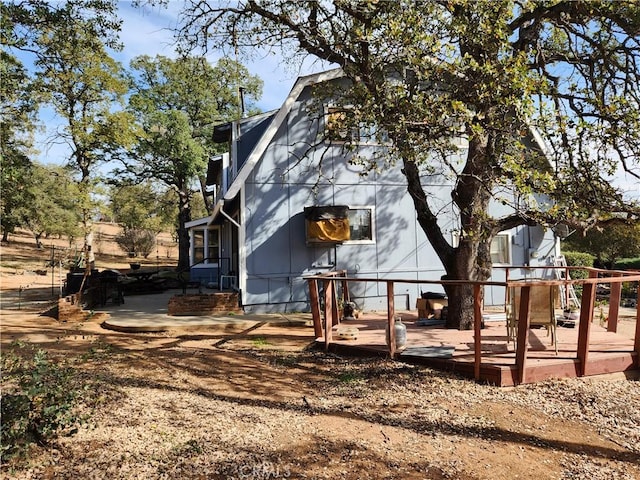 view of property exterior featuring a deck