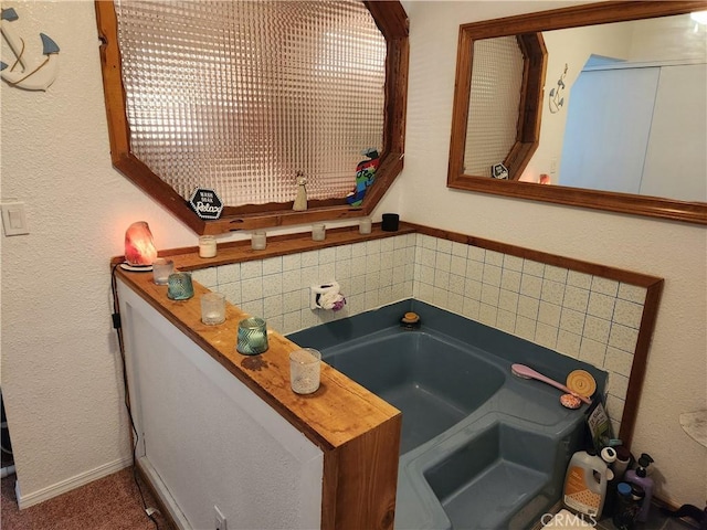 bathroom featuring a tub to relax in