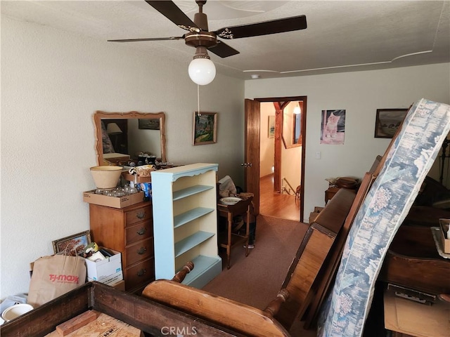 living room featuring ceiling fan and wood-type flooring