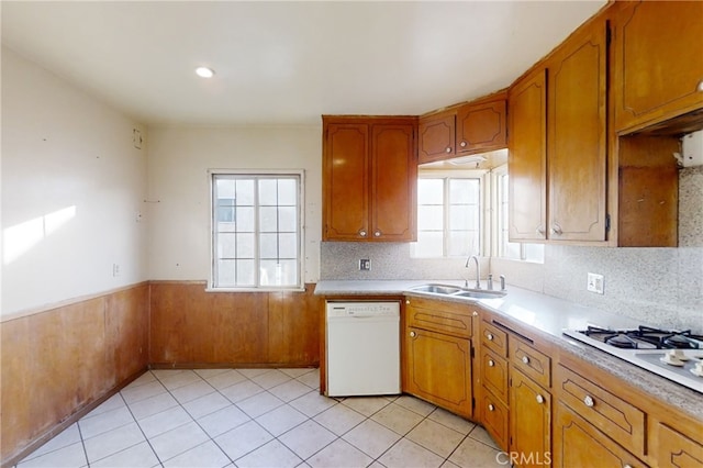 kitchen featuring sink, white appliances, and light tile patterned floors