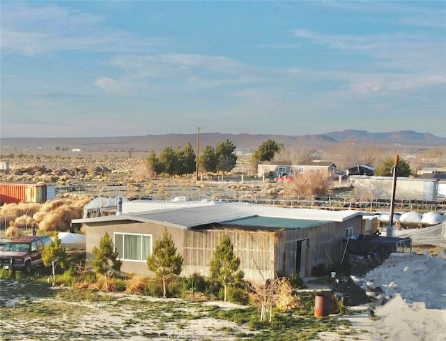 view of swimming pool with a mountain view