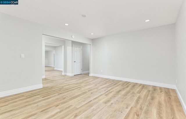 spare room with light hardwood / wood-style floors