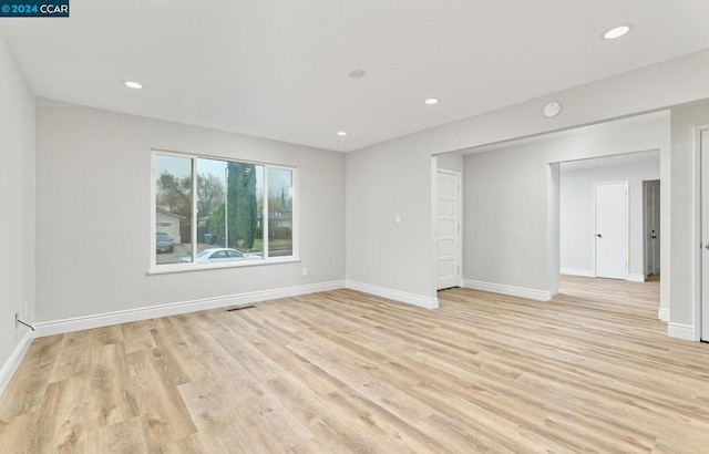 unfurnished room with light hardwood / wood-style flooring