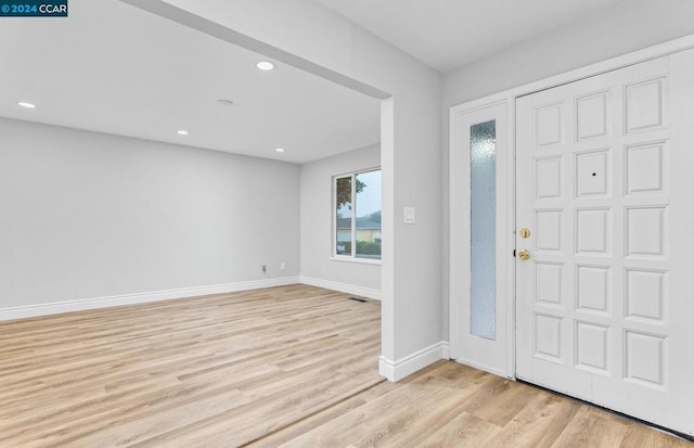 foyer entrance with light hardwood / wood-style flooring