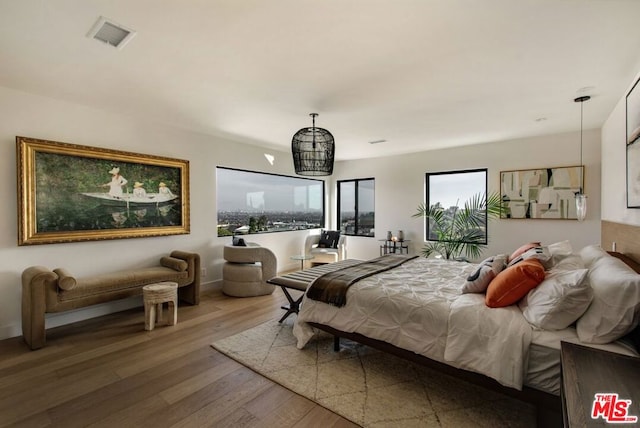 bedroom featuring wood-type flooring