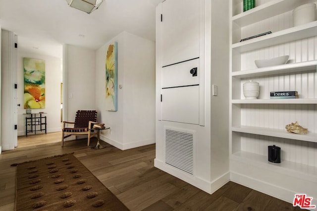 hallway featuring dark hardwood / wood-style flooring