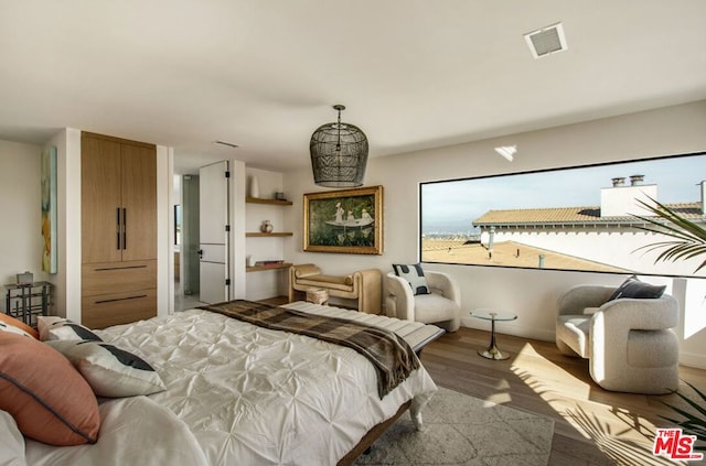 bedroom featuring hardwood / wood-style flooring