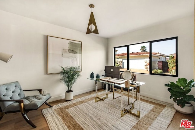 office space with light wood-type flooring