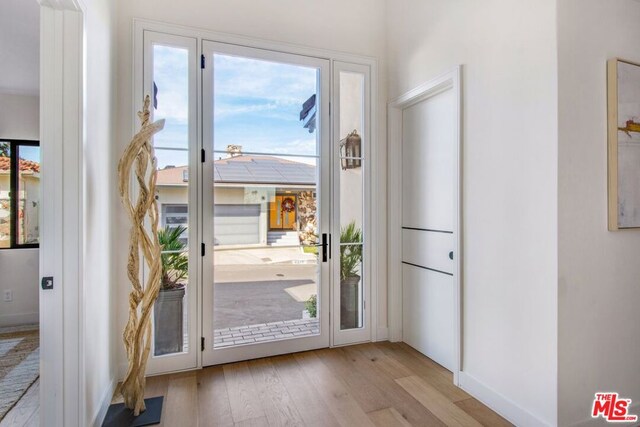 entryway with light hardwood / wood-style floors