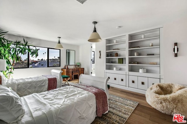 bedroom featuring dark hardwood / wood-style floors