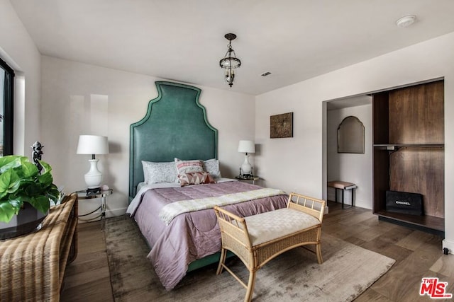 bedroom featuring dark hardwood / wood-style floors