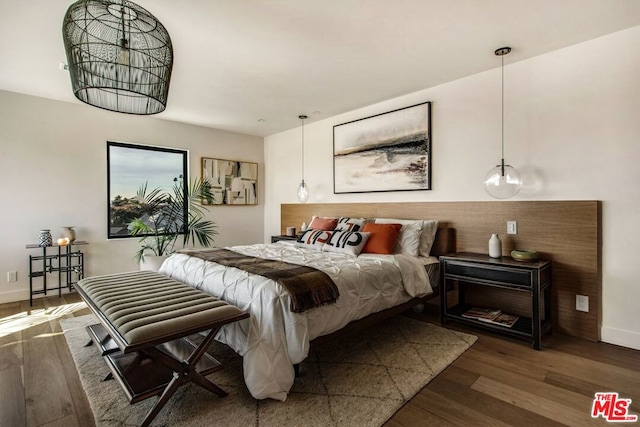 bedroom featuring dark hardwood / wood-style flooring