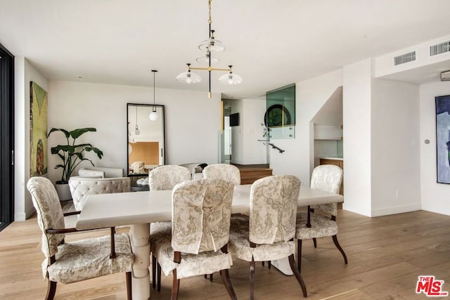 dining space featuring hardwood / wood-style flooring