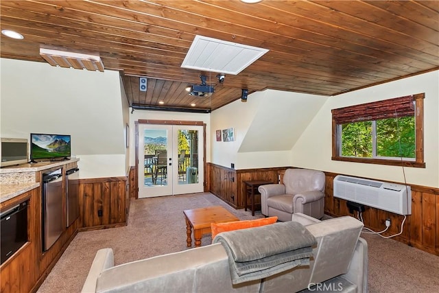 carpeted living room with wooden ceiling, french doors, and wooden walls