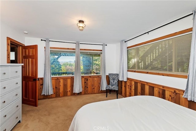 762 Zurich Dr, Lake Arrowhead, CA 92352 - bedroom featuring light carpet, wood walls, and wainscoting