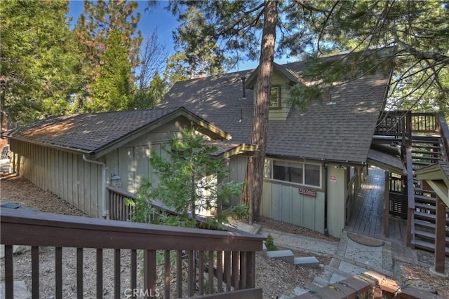 view of side of property featuring a wooden deck