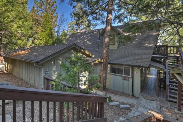 762 Zurich Dr, Lake Arrowhead, CA 92352 - rear view of house with stairway, a shingled roof, and a wooden deck