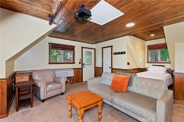 living room featuring a wall unit AC, light colored carpet, wood walls, and wood ceiling