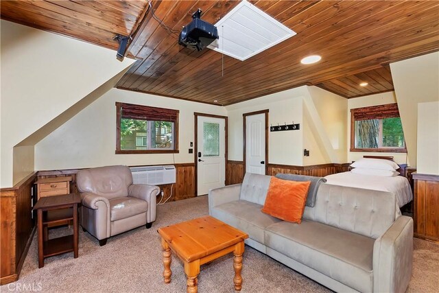 762 Zurich Dr, Lake Arrowhead, CA 92352 - living area with wooden ceiling, wainscoting, a wall unit AC, light colored carpet, and healthy amount of natural light