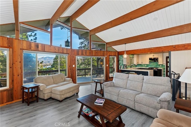 living room with high vaulted ceiling, sink, wood-type flooring, and beam ceiling