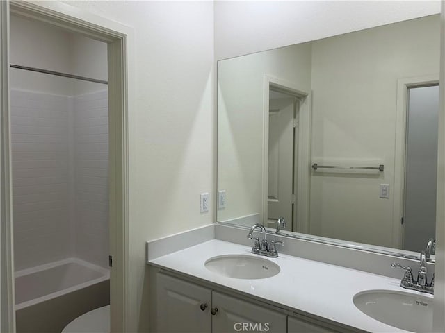 full bathroom featuring bathtub / shower combination, toilet, and vanity