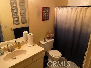 bathroom with toilet and vanity