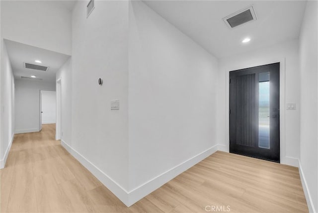 foyer with light hardwood / wood-style floors